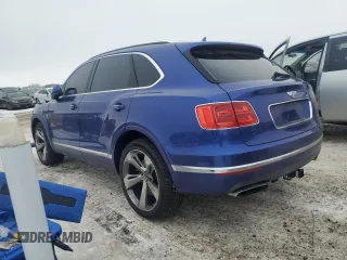 2017 Bentley Bentayga W12 z VIN SJAAC2ZV2HC014080, wystawiony jako Copart lot #44806115 z przebiegiem 63 077 mil mil oraz Szkody całkowita. Historia ofert i sprzedaży dostępna na DreamBid. Obrazek 2.
