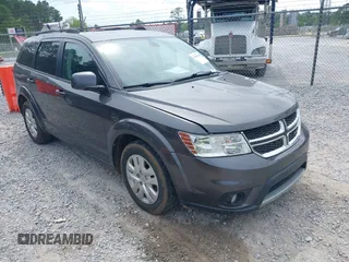 2019 Dodge Journey SE z VIN 3C4PDCBB9KT718185, wystawiony jako IAAI lot #42093249 z przebiegiem 105 777 mil mil oraz . Historia ofert i sprzedaży dostępna na DreamBid. Obrazek 1.