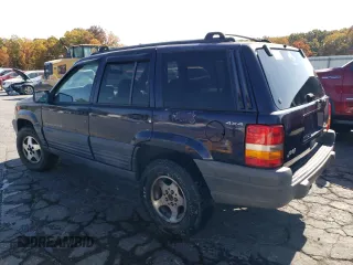1998 Jeep Grand Cherokee Laredo with VIN 1J4GZ58S8WC167716, listed as a Copart auction lot 76477694 with 167,519 mi miles and Salvage Title. Bid and sale history available at carsss.com. Image 2.