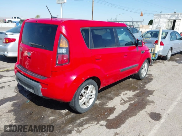 2010 Kia Soul + with VIN KNDJT2A28A7104493, listed as a IAAI auction lot 42023796 with 124,582 mi miles. Bid and sale history available at carsss.com. Image 4.