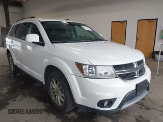 2018 Dodge Journey SXT z VIN 3C4PDDBGXJT469945, wystawiony jako IAAI lot #42266310 z przebiegiem 121 871 mil mil oraz . Historia ofert i sprzedaży dostępna na DreamBid. Obrazek 1.