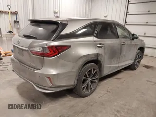 2018 Lexus RX 350L Premium z VIN JTJDZKCA6J2004385, wystawiony jako IAAI lot #41382429 z przebiegiem 111 638 mil mil oraz . Historia ofert i sprzedaży dostępna na DreamBid. Obrazek 4.