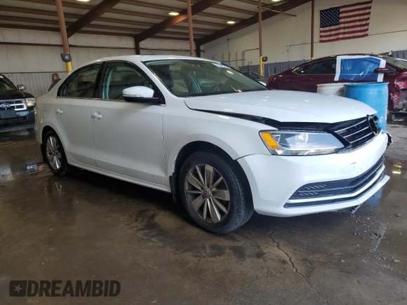 2015 Volkswagen Jetta SE with VIN 3VWD17AJ5FM256703, listed as a Copart auction lot 62699375 with 130,247 mi miles and Salvage title. Bid and sale history available at DreamBid. Image 4.