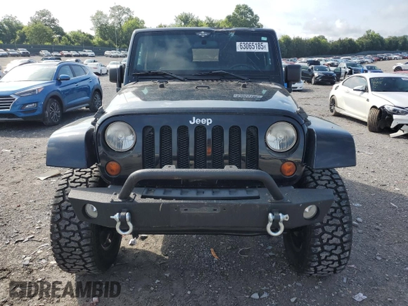 2011 Jeep Wrangler Sahara with VIN 1J4AA5D15BL552185, listed as a Copart auction lot 63065185 with 159,850 mi miles and Salvage title. Bid and sale history available at DreamBid. Image 5.