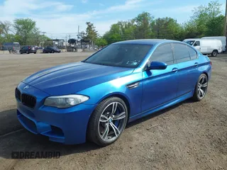 2013 BMW M5 with VIN WBSFV9C56DC774032, listed as a IAAI auction lot 42124754 with 55,409 mi miles. Bid and sale history available at carsss.com. Image 2.