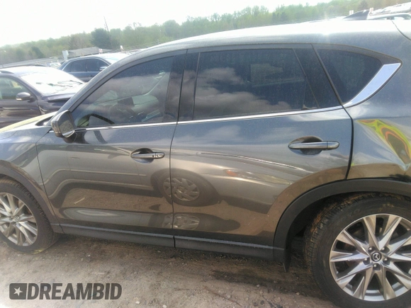 2019 Mazda CX-5 Grand Touring with VIN JM3KFBDM7K0606860, listed as a IAAI auction lot 41936338 with 93,057 mi miles. Bid and sale history available at carsss.com. Image 14.