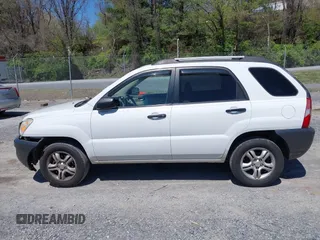 2006 Kia Sportage LX with VIN KNDJF723567151614, listed as a IAAI auction lot 42022102 with 128,564 mi miles and . Bid and sale history available at carsss.com. Image 14.