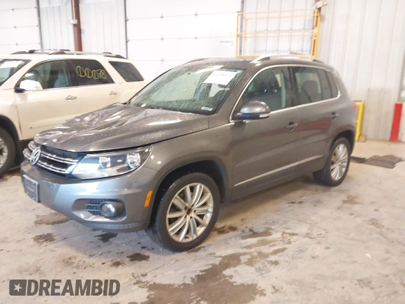 2012 Volkswagen Tiguan SE with VIN WVGBV7AX6CW093750, listed as a IAAI auction lot 42329775 with 117,509 mi miles and . Bid and sale history available at DreamBid. Image 2.