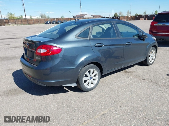 2011 Ford Fiesta SE with VIN 3FADP4BJ7BM135864, listed as a IAAI auction lot 42134479 with 118,573 mi miles. Bid and sale history available at carsss.com. Image 4.