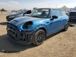 2023 MINI Hardtop Cooper SE with VIN WMW13DJ03P2T91531, listed as a Copart auction lot 54220585 with 7,054 mi miles and Salvage title. Bid and sale history available at DreamBid. Image 1.