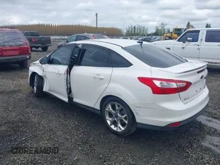 2014 Ford Focus Titanium with VIN 1FADP3J27EL142095, listed as a IAAI auction lot 42004419 with 139,515 mi miles. Bid and sale history available at carsss.com. Image 3.