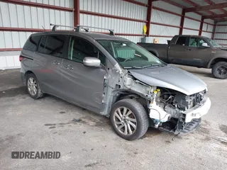 2014 Mazda 5 Sport with VIN JM1CW2BL0E0164838, listed as a IAAI auction lot 42460513 with 136,831 mi miles and . Bid and sale history available at DreamBid. Image 1.