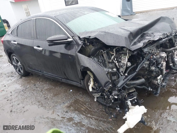 2017 Honda Civic Sedan Touring with VIN 2HGFC1F99HH658034, listed as a IAAI auction lot 41563627 with 140,819 mi miles. Bid and sale history available at carsss.com. Image 1.