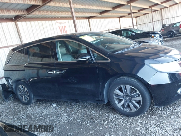 2014 Honda Odyssey Touring with VIN 5FNRL5H94EB110590, listed as a IAAI auction lot 42092929 with 242,338 mi miles and . Bid and sale history available at DreamBid. Image 14.
