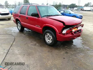 2004 Chevrolet Blazer LS z VIN 1GNDT13X34K115359, wystawiony jako IAAI lot #41791256 z przebiegiem 156 276 mil mil oraz . Historia ofert i sprzedaży dostępna na DreamBid. Obrazek 1.