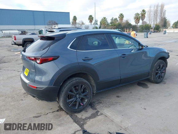 2023 Mazda CX-30 S Carbon Edition with VIN 3MVDMBCM7PM589019, listed as a IAAI auction lot 41251168 with 23,847 mi miles and . Bid and sale history available at DreamBid. Image 4.