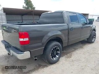 2005 Ford F-150 XLT with VIN 1FTPW12535KF05473, listed as a IAAI auction lot 42140281 with 163,023 mi miles. Bid and sale history available at carsss.com. Image 4.