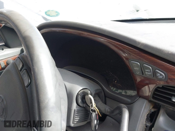 2004 Cadillac DeVille DHS z VIN 1G6KE57Y74U119605, wystawiony jako IAAI lot #40555057 z przebiegiem Nie podano mil oraz . Historia ofert i sprzedaży dostępna na DreamBid. Obrazek 15.