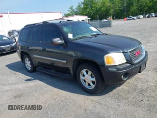 2004 GMC Envoy SLE with VIN 1GKDT13S042223181, listed as a IAAI auction lot 42137889 with 1 mi miles. Bid and sale history available at carsss.com. Image 1.