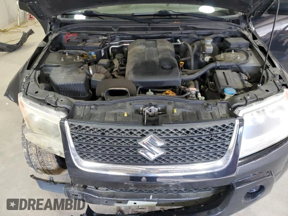 2012 Suzuki Grand Vitara Premium z VIN JS3TD0D66C4100814, wystawiony jako Copart lot #89250025 z przebiegiem 102 381 mil mil oraz Szkody całkowita. Historia ofert i sprzedaży dostępna na DreamBid. Obrazek 13.