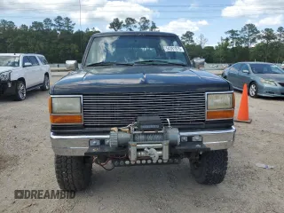 1990 Ford Bronco z VIN 1FMCU14T9LUA15536, wystawiony jako Copart lot #54391815 z przebiegiem 319 124 mil mil oraz Szkoda całkowita • Salvage title. Historia ofert i sprzedaży dostępna na DreamBid. Obrazek 5.