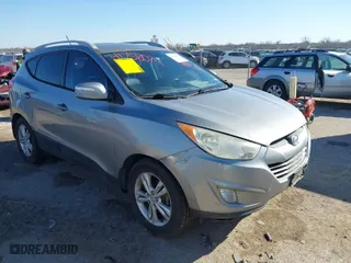 2013 Hyundai Tucson GLS with VIN KM8JU3ACXDU769618, listed as a IAAI auction lot 41758074 with 148,848 mi miles. Bid and sale history available at carsss.com. Image 1.