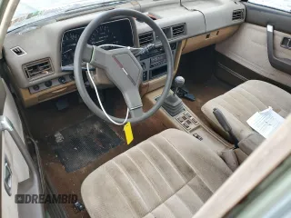 1981 Mazda 626 z VIN JM1GB2216B0531636, wystawiony jako Copart lot #54201075 z przebiegiem 41 823 mil mil oraz Szkoda całkowita • Salvage title. Historia ofert i sprzedaży dostępna na DreamBid. Obrazek 8.