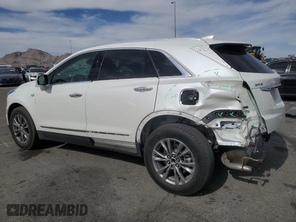 2021 Cadillac XT5 FWD Premium Luxury with VIN 1GYKNCRS0MZ110560, listed as a Copart auction lot 52779575 with 44,559 mi miles and Salvage title. Bid and sale history available at DreamBid. Image 2.