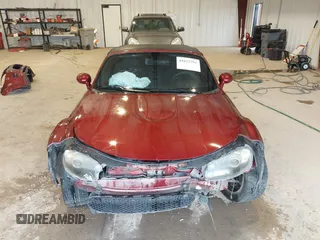 2007 Mazda MX-5 Miata Sport z VIN JM1NC25F970132299, wystawiony jako IAAI lot #41622791 z przebiegiem 72 392 mil mil oraz . Historia ofert i sprzedaży dostępna na DreamBid. Obrazek 13.