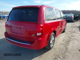 2014 Dodge Grand Caravan SXT with VIN 2C4RDGCG8ER245316, listed as a IAAI auction lot 41871425 with 150,361 mi miles and . Bid and sale history available at DreamBid. Image 4.