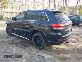 2015 Jeep Grand Cherokee Overland with VIN 1C4RJECGXFC957530, listed as a IAAI auction lot 41633522 with 168,258 mi miles and . Bid and sale history available at DreamBid. Image 3.