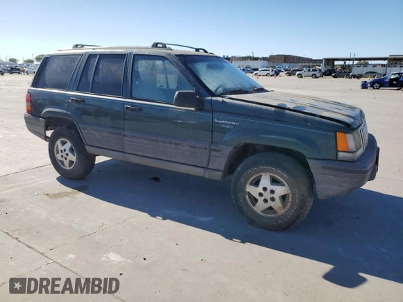 1995 Jeep Grand Cherokee Laredo with VIN 1J4FX58S5SC741328, listed as a Copart auction lot 82034594 with 260,398 mi miles and Clean Title. Bid and sale history available at carsss.com. Image 4.