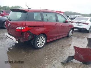 2012 Mazda 5 Grand Touring with VIN JM1CW2DL8C0142628, listed as a IAAI auction lot 42350676 with 84,764 mi miles and . Bid and sale history available at DreamBid. Image 4.