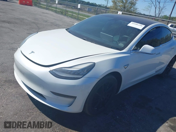 2019 Tesla Model 3 Mid Range with VIN 5YJ3E1EA7KF425127, listed as a IAAI auction lot 41886436 with 87,236 mi miles and . Bid and sale history available at carsss.com. Image 17.