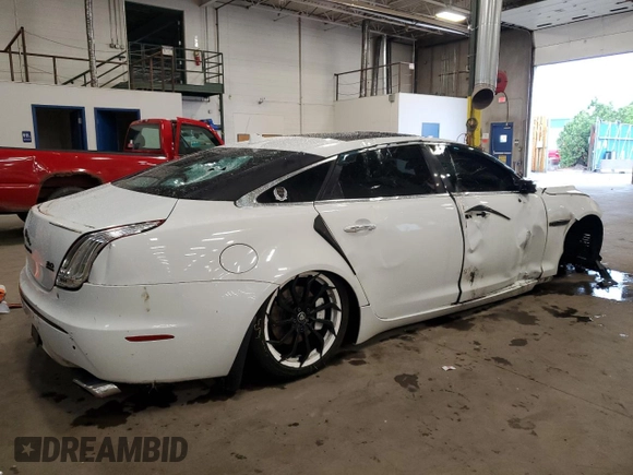 2014 Jaguar XJ Portfolio with VIN SAJWJ2GD2E8V69597, listed as a Copart auction lot 57798145 with 100,857 mi miles and Salvage title. Bid and sale history available at DreamBid. Image 3.