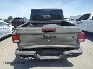 2023 Jeep Gladiator Sport S с VIN 1C6HJTAG3PL552959, выставлен на аукционе Copart как лот 56905635 с пробегом 30 356 миль миль и Списание • Salvage title. История ставок и продаж доступна на DreamBid. Изображение 6.