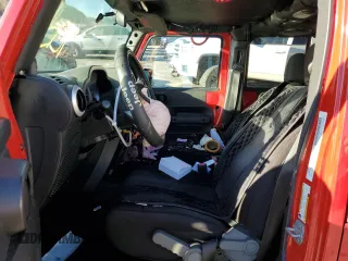 2010 Jeep Wrangler Unlimited Sahara with VIN 1J4BA5H12AL167115, listed as a Copart auction lot 79400574 with 0 mi miles and Salvage Title. Bid and sale history available at carsss.com. Image 7.