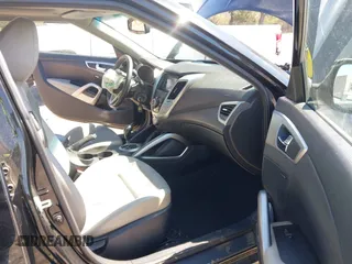 2013 Hyundai Veloster w/Gray Int with VIN KMHTC6AD9DU137473, listed as a IAAI auction lot 41846203 with 67,781 mi miles. Bid and sale history available at carsss.com. Image 5.