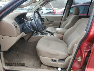 2002 Jeep Grand Cherokee with VIN 1J8GX38S92C176329, listed as a Copart auction lot 47885635 with 154,167 mi miles and Salvage title. Bid and sale history available at DreamBid. Image 7.