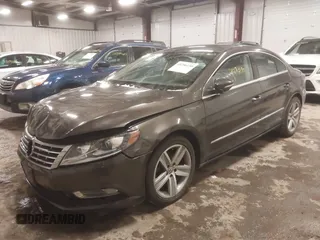 2015 Volkswagen CC R-Line z VIN WVWBP7AN0FE829797, wystawiony jako IAAI lot #41296150 z przebiegiem 138 608 mil mil oraz . Historia ofert i sprzedaży dostępna na DreamBid. Obrazek 2.