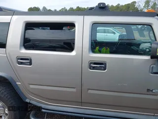 2005 Hummer H2 SUV with VIN 5GRGN23U65H101545, listed as a IAAI auction lot 41426274 with 293,821 mi miles. Bid and sale history available at carsss.com. Image 13.