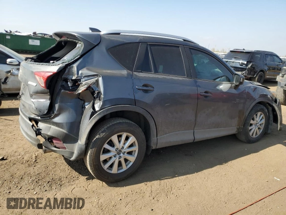 2014 Mazda CX-5 Sport z VIN JM3KE4BE1E0359446, wystawiony jako Copart lot #54562545 z przebiegiem 128 150 mil mil oraz Szkoda całkowita • Salvage title. Historia ofert i sprzedaży dostępna na DreamBid. Obrazek 3.