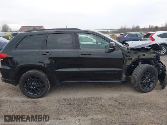 2021 Jeep Grand Cherokee 80th Anniversary with VIN 1C4RJFBG7MC828116, listed as a IAAI auction lot 42118355 with 57,240 mi miles and . Bid and sale history available at DreamBid. Image 14.