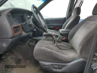 1996 Jeep Grand Cherokee with VIN 1J4EZ58S8TC106529, listed as a Copart auction lot 50163965 with 226,951 mi miles and Salvage title. Bid and sale history available at DreamBid. Image 7.