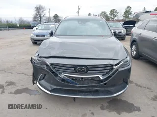 2016 Mazda CX-9 Grand Touring with VIN JM3TCADY4G0111310, listed as a IAAI auction lot 41532851 with 178,907 mi miles and . Bid and sale history available at DreamBid. Image 12.