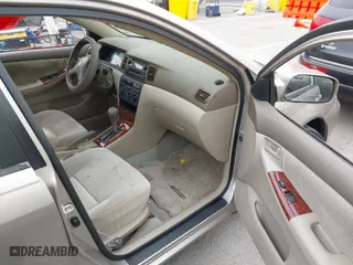 2003 Toyota Corolla CE with VIN 1NXBR32E73Z137535, listed as a IAAI auction lot 42041727 with 243,586 mi miles. Bid and sale history available at carsss.com. Image 5.