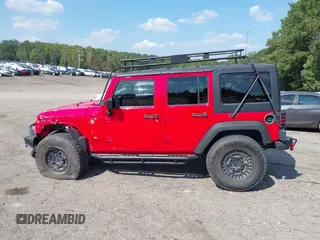 2016 Jeep Wrangler Unlimited Rubicon with VIN 1C4HJWFG7GL128994, listed as a IAAI auction lot 40503403 with 85,950 mi miles. Bid and sale history available at carsss.com. Image 14.