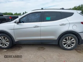 2018 Hyundai Santa Fe 2.0T z VIN 5XYZU4LA9JG537310, wystawiony jako IAAI lot #42393689 z przebiegiem Nie podano mil oraz . Historia ofert i sprzedaży dostępna na DreamBid. Obrazek 14.