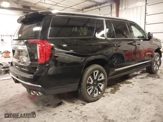 2021 GMC Yukon XL Denali with VIN 1GKS2JKL3MR149850, listed as a IAAI auction lot 41588274 with 77,181 mi miles. Bid and sale history available at carsss.com. Image 4.