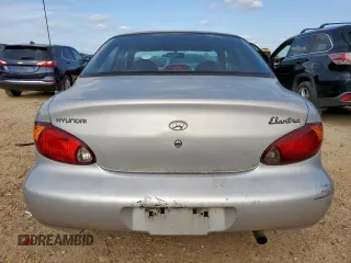 1999 Hyundai Elantra z VIN KMHJF25F1XU777099, wystawiony jako Copart lot #58870035 z przebiegiem 69 470 mil mil oraz Czysty tytuł • Clean title. Historia ofert i sprzedaży dostępna na DreamBid. Obrazek 6.